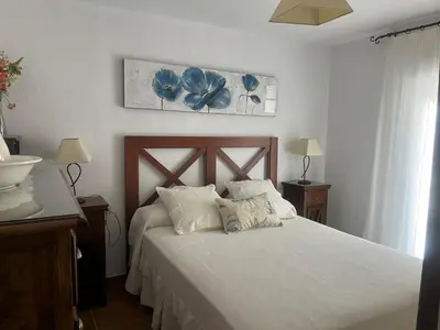 a bedroom with a bed with two pillows on it at Mi Paraiso in Sanlúcar de Barrameda