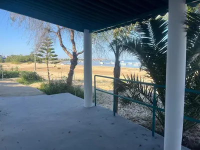 a view of the beach from the porch of a beach house at Mi Paraiso in Sanlúcar de Barrameda