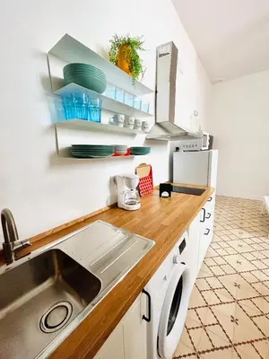 a kitchen with a sink and a counter at SOTAVENTO Salmarina in Sanlúcar de Barrameda