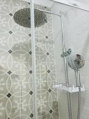 a shower with a glass door in a bathroom at Sotavento Malandar in Sanlúcar de Barrameda