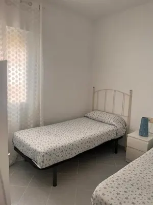 a bedroom with two beds in a room at PISO CENTRO HISTÓRICO 3 DORMITORIOS in Jerez de la Frontera