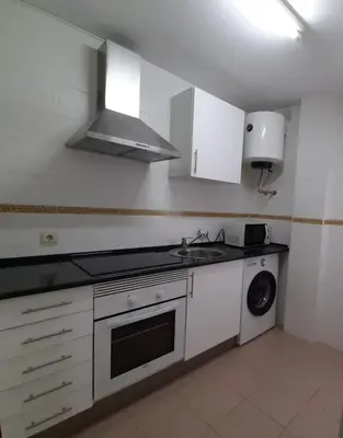 a kitchen with a sink and a washing machine at PISO CENTRO HISTÓRICO 3 DORMITORIOS in Jerez de la Frontera