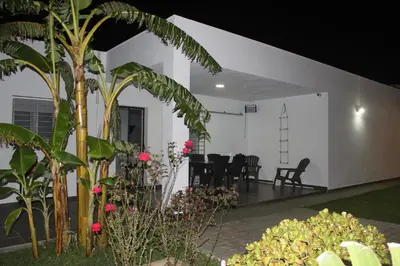 a house with a courtyard with plants and flowers at Finca La Garrocha in Conil de la Frontera