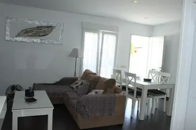 a living room with a couch and a table at Finca La Garrocha in Conil de la Frontera