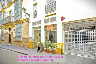 a store window on a street in front of a building at Mercado Abastos Central Apartment in El Puerto de Santa María