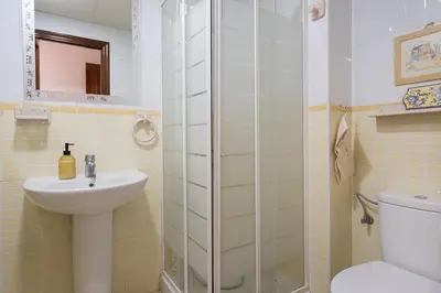 a bathroom with a shower and a sink and a toilet at Maravilloso apartamento junto al mar a 5 km Cadiz in Puerto Real