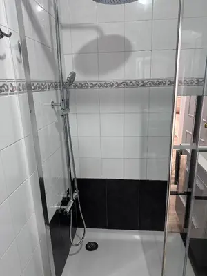 a shower with a glass door in a bathroom at TORREJÓN in Jerez de la Frontera