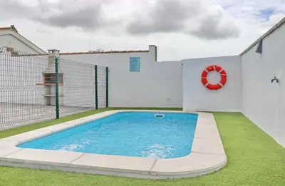 a swimming pool in the backyard of a house at Casa El Rellano in Hozanejos