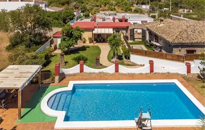 an overhead view of a swimming pool and a house at Nice Home In Chiclana De La Fronter in Chiclana de la Frontera