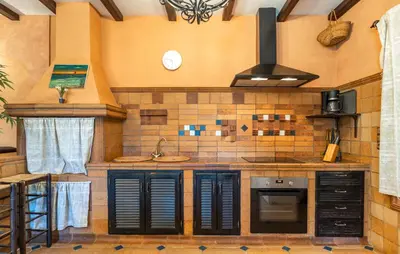 a kitchen with a sink and a stove at Nice Home In Chiclana De La Fronter in Chiclana de la Frontera