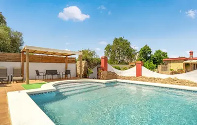 a swimming pool with a slide and a skate park at Nice Home In Chiclana De La Fronter in Chiclana de la Frontera