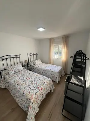a bedroom with two beds and a ladder in it at Apartamento de Encanto in San Fernando