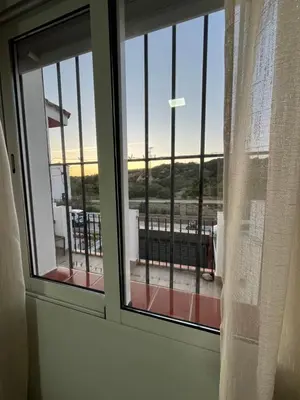 a window with a view of a balcony at Apartamento de Encanto in San Fernando