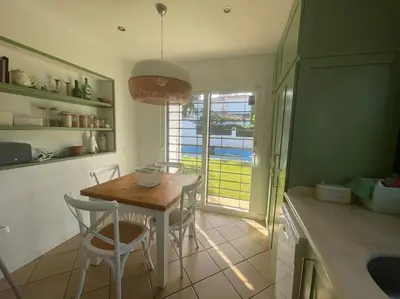 a kitchen with a table and chairs and a window at Sunset Villa Arcos in Arcos de la Frontera