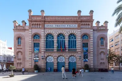 a large building with people standing outside of it at Falla Suite Bajo in Cádiz