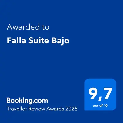 a blue screen with the text awarded to fallia suite bba at Falla Suite Bajo in Cádiz