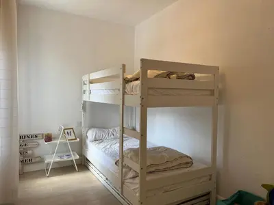 a bedroom with two bunk beds in a room at Ancora - Piscina & Playa in El Puerto de Santa María