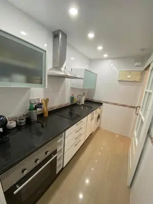 a kitchen with a sink and a counter top at Espectacular Valdemar in El Puerto de Santa María