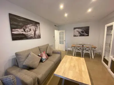 a living room with a couch and a table at Espectacular Valdemar in El Puerto de Santa María