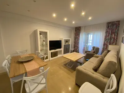 a living room with a couch and a table at Espectacular Valdemar in El Puerto de Santa María