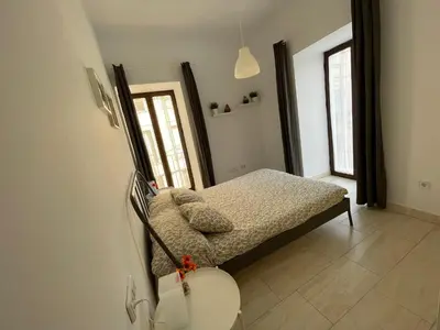 a bedroom with a bed and a toilet in it at Apartamento en pleno centro de Jerez de la Frontera in Jerez de la Frontera