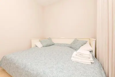 a bedroom with a bed with two pillows at Carmen Viejo in Sanlúcar de Barrameda