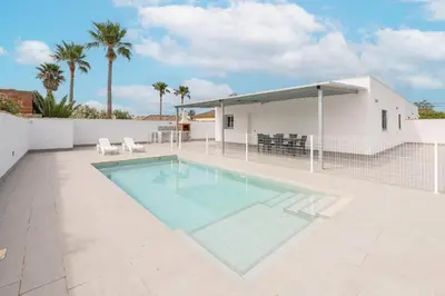a swimming pool in the backyard of a house at Miamar 2 in Hozanejos