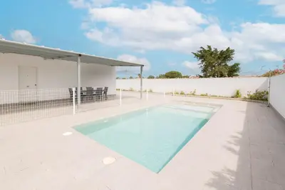 a swimming pool in the backyard of a house at Miamar 2 in Hozanejos