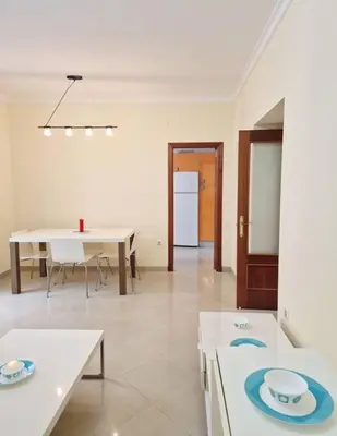 a room with two tables and a dining room at Roy's Cadiz Inn in Cádiz