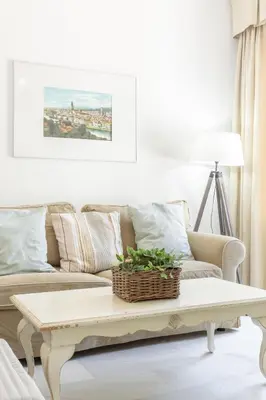 a living room with a couch and a coffee table at Apartamento con terraza en Playa de Regla. 6. in Chipiona