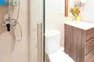 a bathroom with a shower and a toilet and a sink at Summerlandrota Veracruz28 in Rota