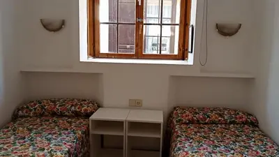 a small room with a bed and a window at Apartamentos Jasmund - Bungalow 119 in San Fernando