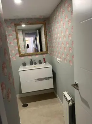 a bathroom with a sink and a mirror at Novo Sancti Petri in Cádiz