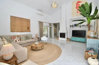a living room with a couch and a table at Chici - Holiday Chiclana in Chiclana de la Frontera