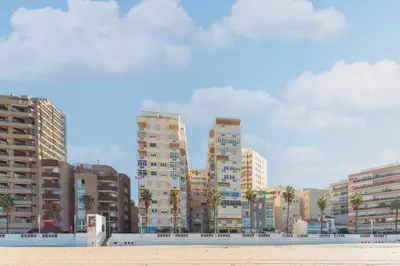 a view of a city with tall buildings at Disfruta Vacaciones Familiares Piso Frente al Mar in Cádiz