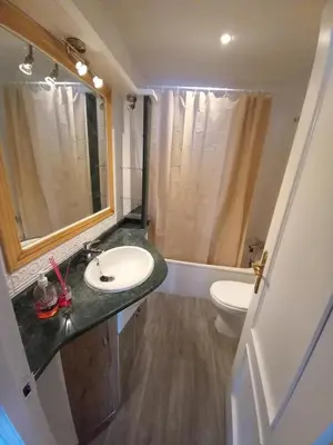 a bathroom with a sink and a toilet at Apartamento Centro Estación, Parking Privado in El Puerto de Santa María