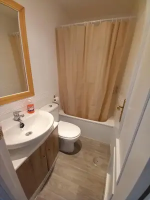 a bathroom with a sink and a toilet and a shower at Apartamento Centro Estación, Parking Privado in El Puerto de Santa María