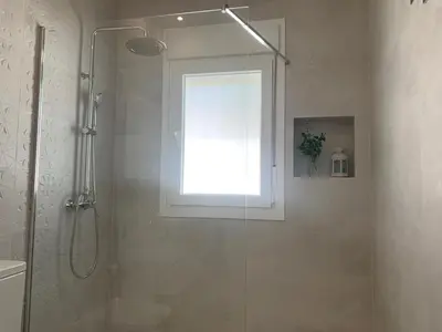 a bathroom with a shower with a window at Chalet junto a la playa en Costa Sancti Petri in Chiclana de la Frontera