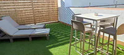 a patio with a table and chairs on a balcony at BRUJULA ground floor indoor apartment by Cadiz4Rentals in Cádiz