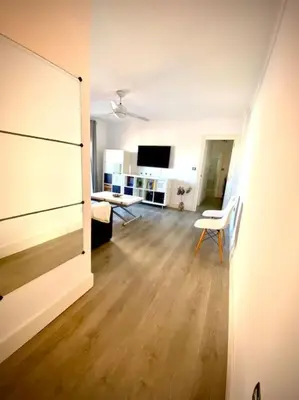 a room with a living room with a hard wood floor at MyChoice San Francisco in Rota