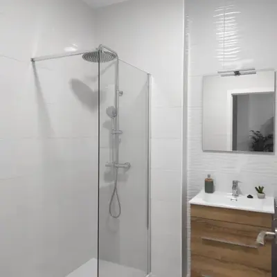 a white bathroom with a shower and a sink at Ohana 2 in San Fernando