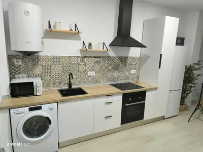 a kitchen with a washing machine and a sink at Ohana 2 in San Fernando