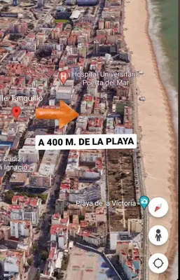 an aerial view of a beach with an orange arrow at Apartamento Playa Tanguillos del Mar in Cádiz