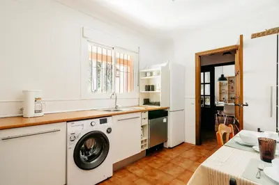 a kitchen with a washing machine and a sink at Fabiana in Chiclana de la Frontera