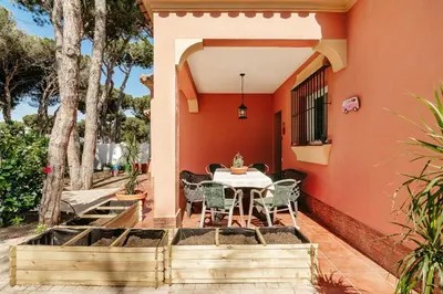a patio with a table and chairs in a house at Fabiana in Chiclana de la Frontera