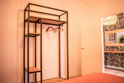 a bedroom with a bunk bed and a mirror at Apartamentos Ribera del Rio 36 in El Puerto de Santa María