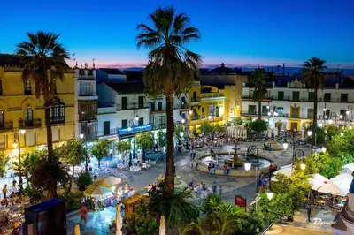 an overhead view of a town at night at Sanlúcarsun Apartamento en el centro in Sanlúcar de Barrameda