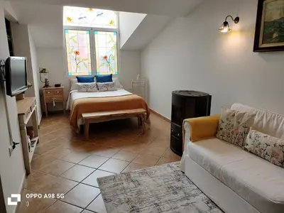 a living room with a couch and a window at Chalet vacacional in El Puerto de Santa María