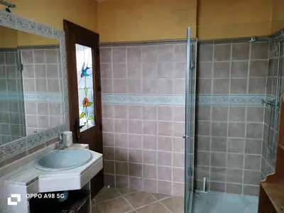 a bathroom with a sink and a shower at Chalet vacacional in El Puerto de Santa María