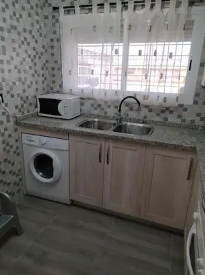 a kitchen with a sink and a washing machine at apartamento en Puerto Real in El Trocadero